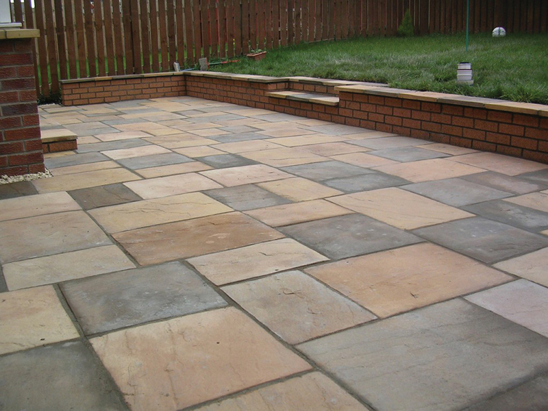 Patio image with brick retaining walls and step details.