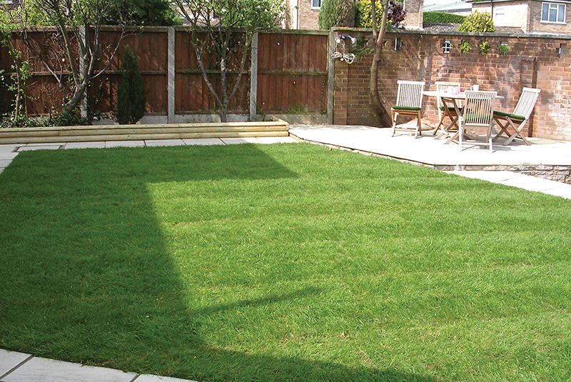 Artificial turf image showing a landscaped lawn area.